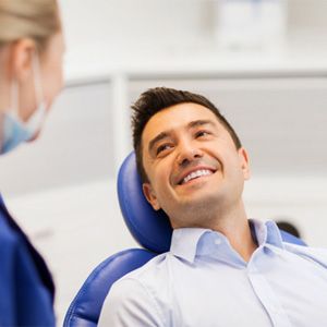 Man smiling in dental chair 