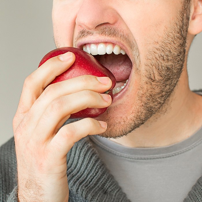 Implant dentures allow you to eat a healthy diet including fresh fruits and vegetables