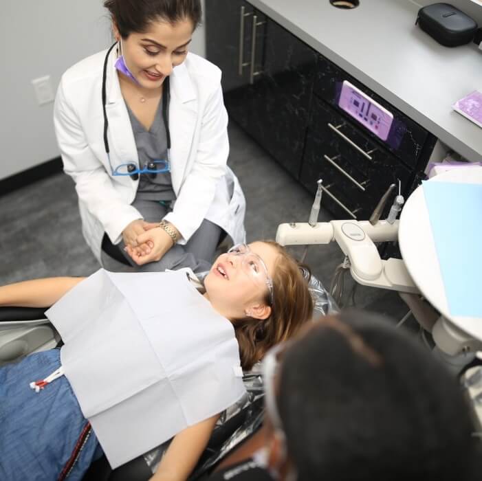 Young girl at checkup with dentist in Frisco