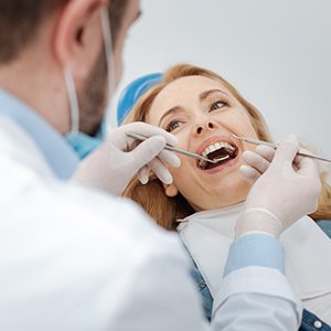 patient getting dental checkup in Frisco