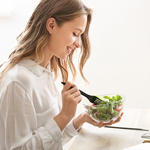 young woman eating healthy food