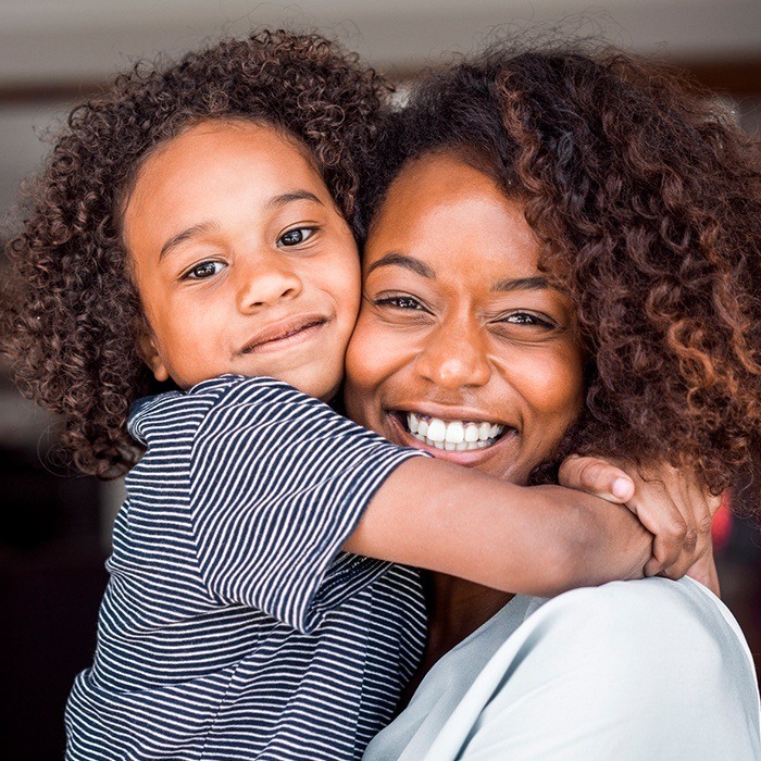 Mother and daughter smiling after children's dentistry visit