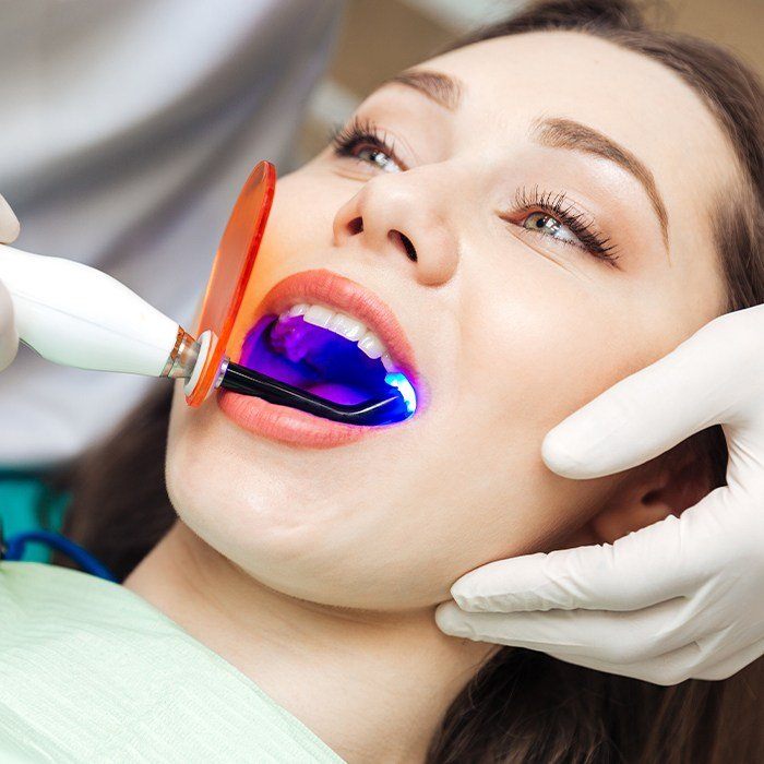 Woman receiving dental sealants