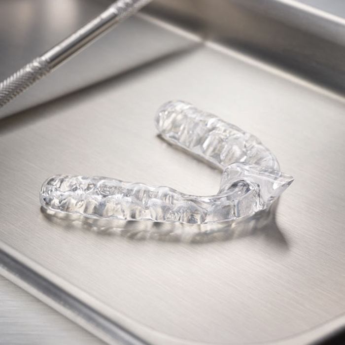 Clear nightguard for bruxism on metal tray