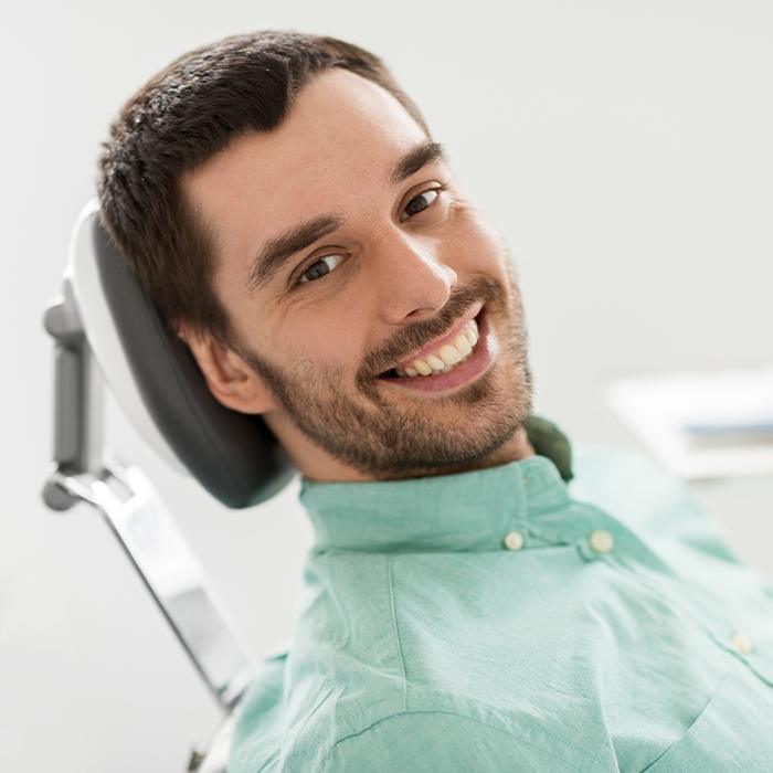 Man smiling after root canal therapy