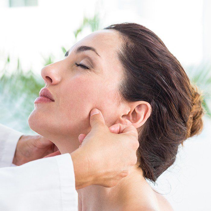 Dentist checking patient's jaw alignment