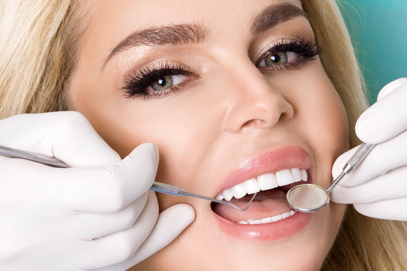 Woman with veneers at dental examination