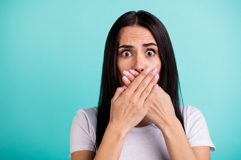 woman in shock covering her mouth