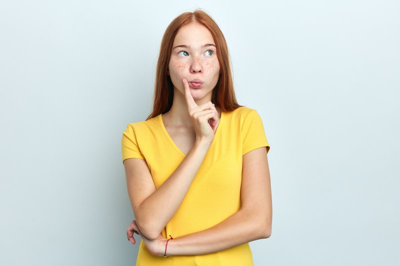 A puzzled woman trying to answer a question