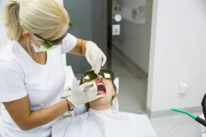 Woman undergoing laser gum disease treatment
